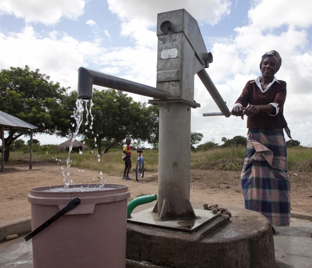 Helena Carlica Nhunho pumps waterMachanga District, Mozambique. February 2011.